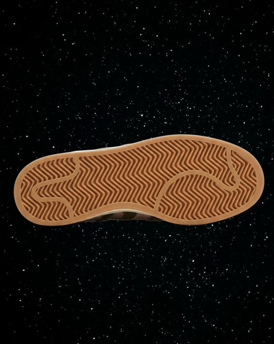 Bottom view of LegitGCC Adidas Campus sneaker featuring a brown rubber herringbone tread pattern sole